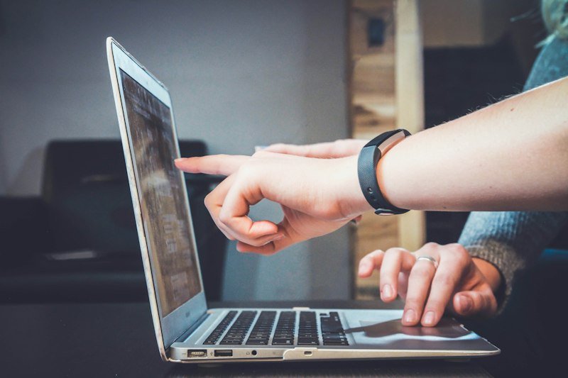 Teaching online with a laptop and study notes
