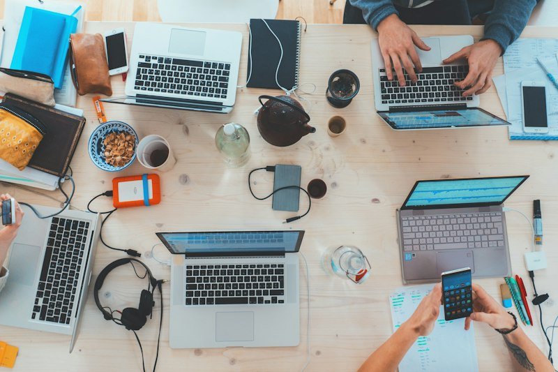 Remote team collaborating on laptops
