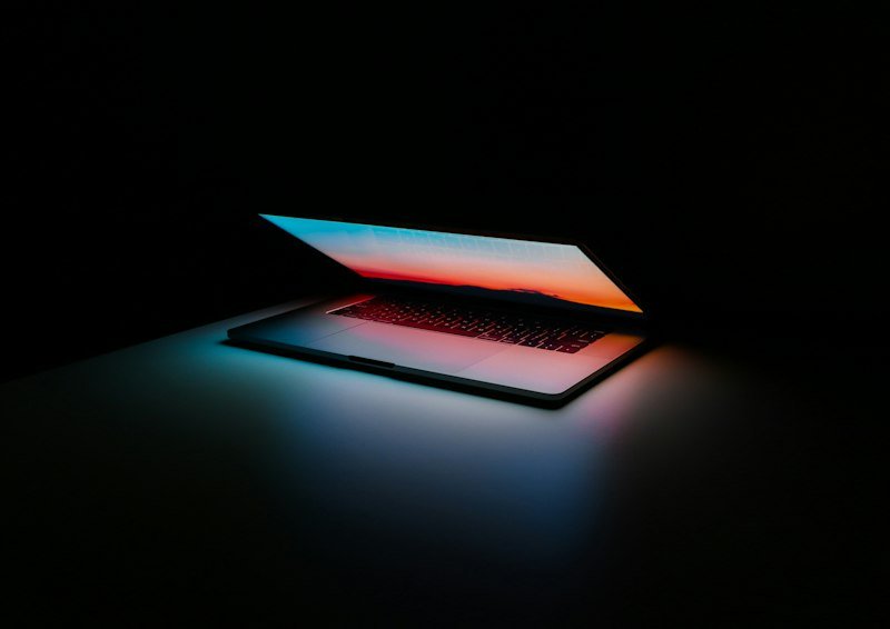 Laptop and phone in a modern tech workspace