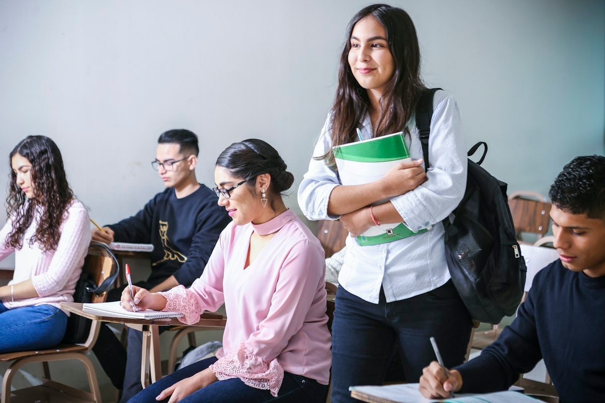 How to make money selling online courses - students learning with laptops
